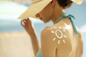 Image of woman wearing sunscreen.